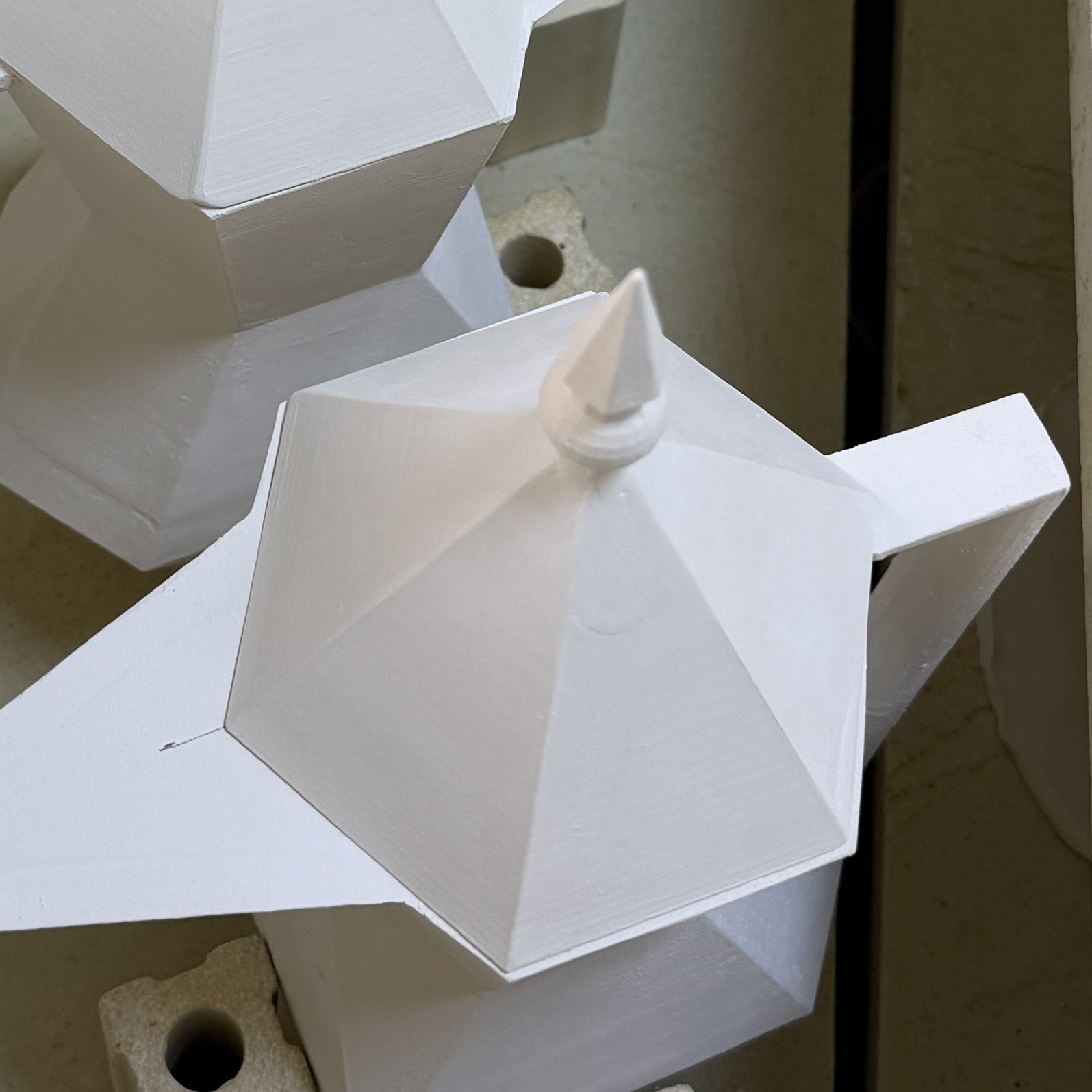 Unglazed faceted ceramic form