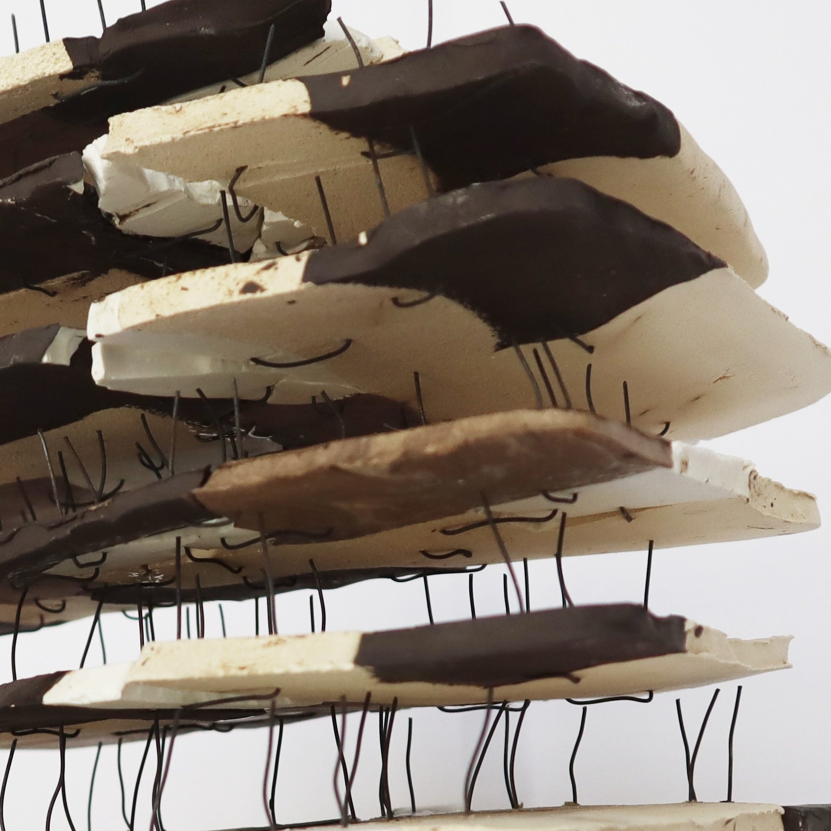 Stacked ceramic fragments joined with wire