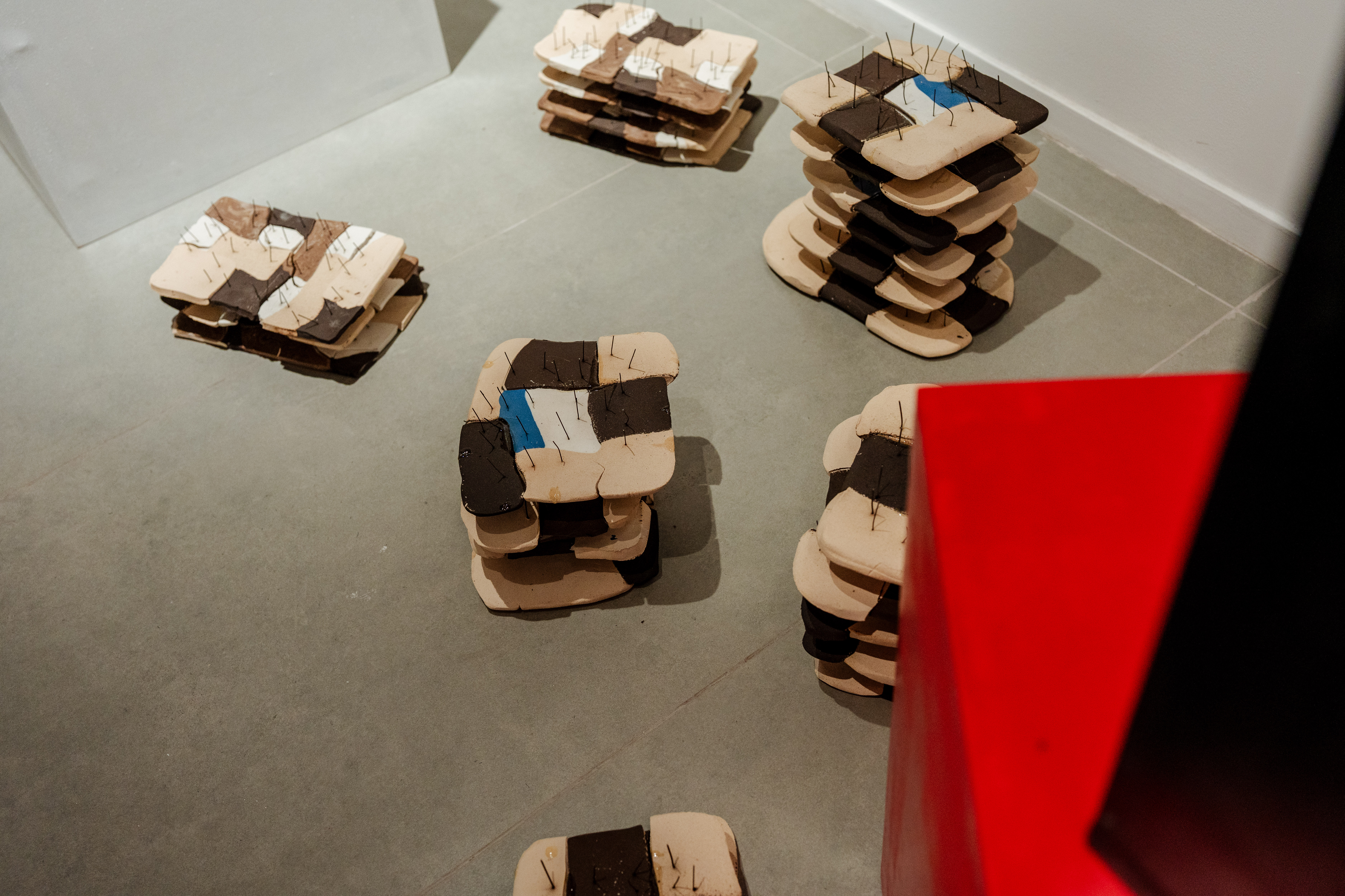 Ceramic fragment stacks on gallery floor