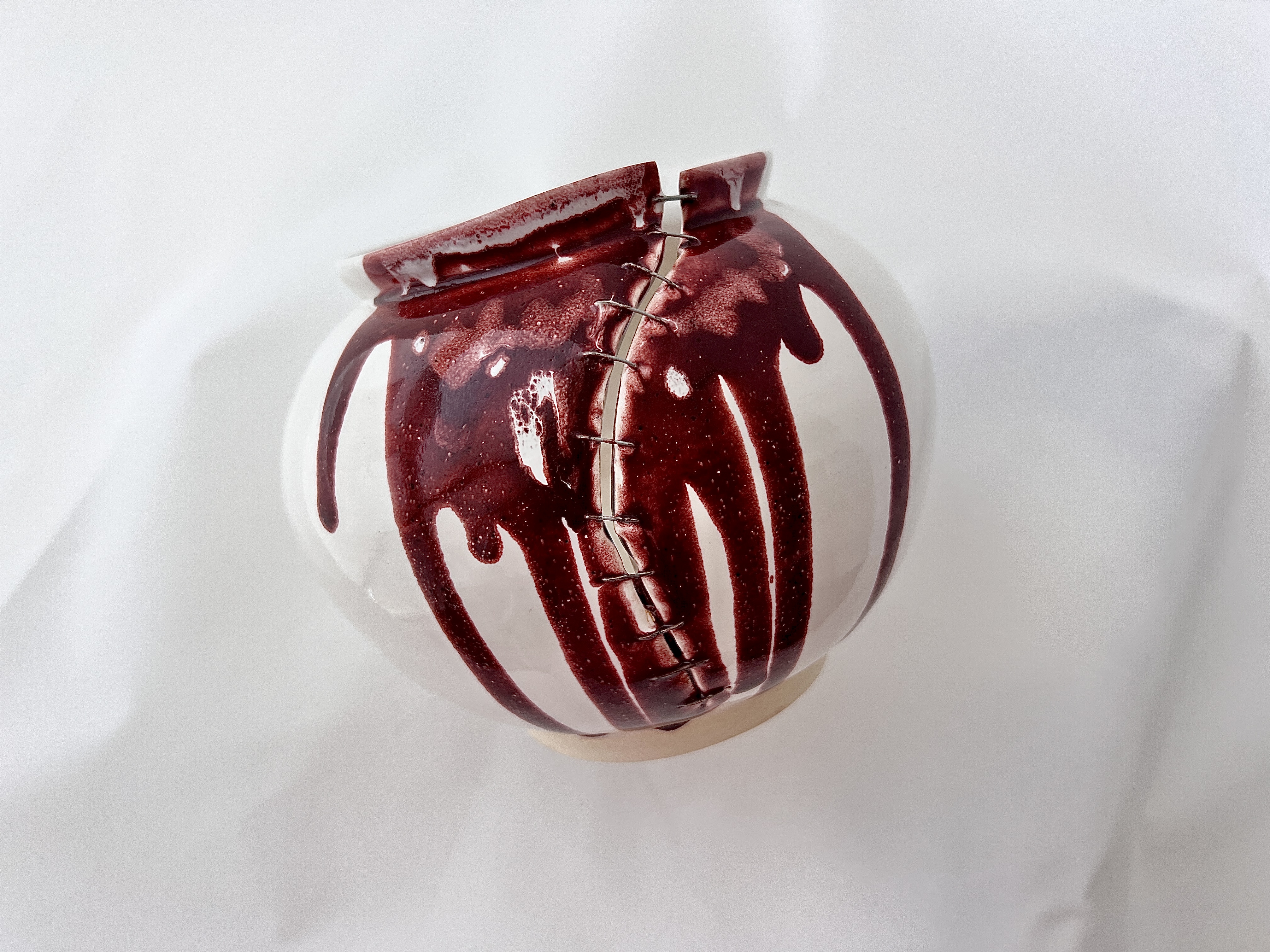 Self I, 2024, moon jar ceramic with wire stitching