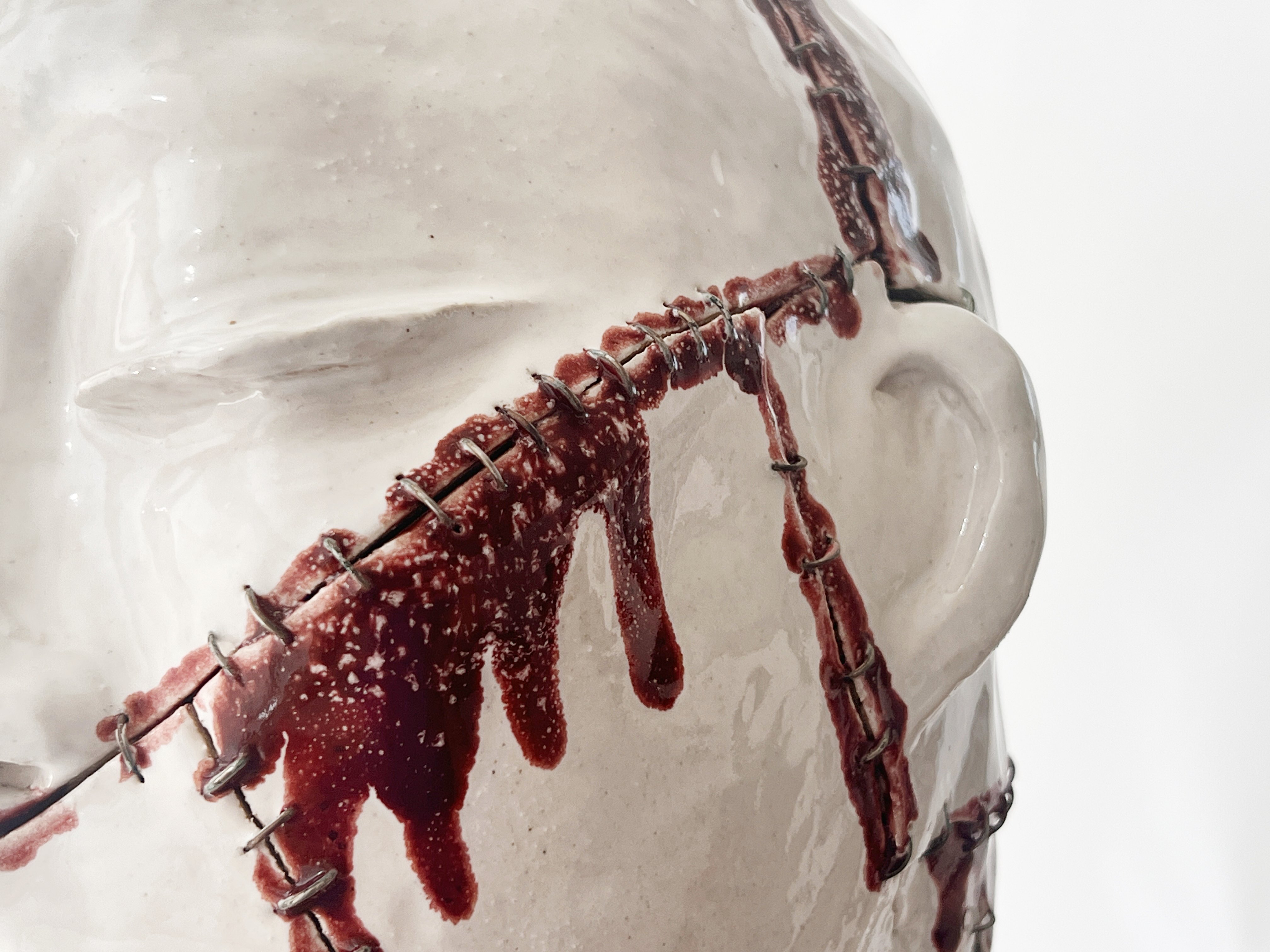 Self II detail — wire stitching close-up